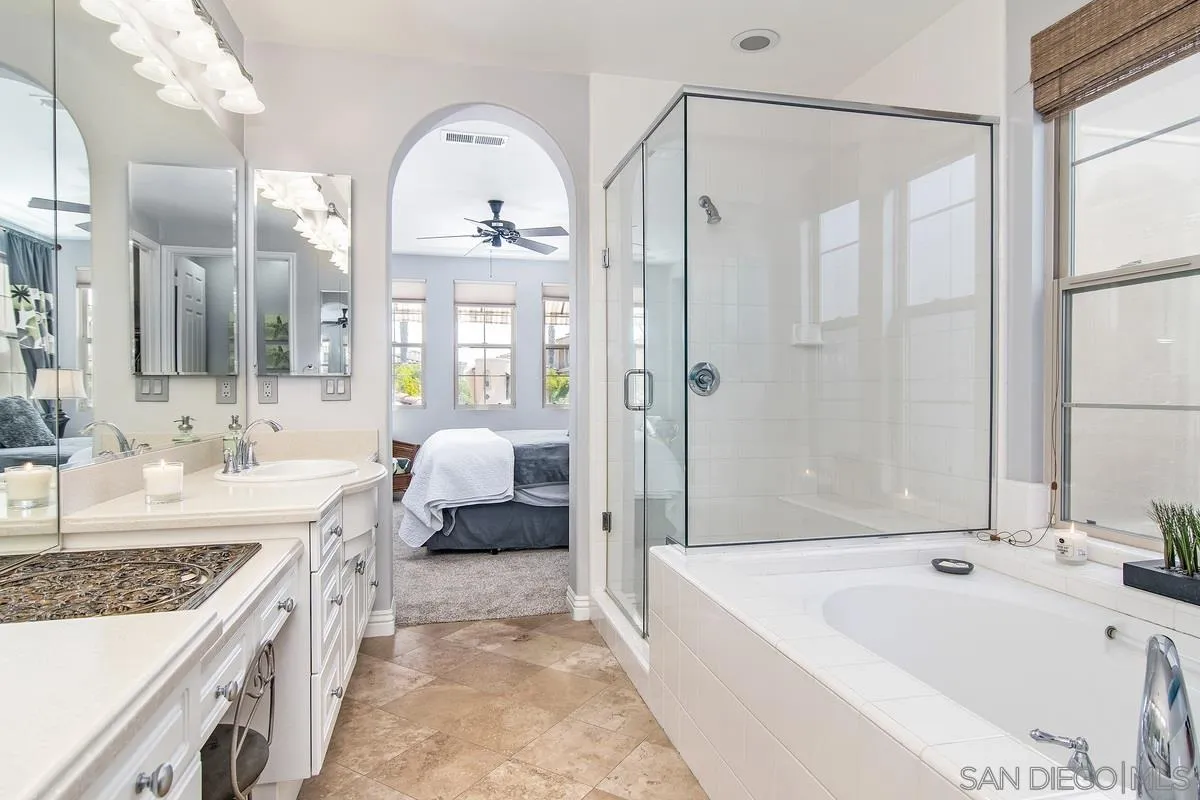 2080 Historic Decatur Road San Diego, CA 92106 - Photo 25 of 47 a spacious bathroom with a granite countertop tub sink and mirror