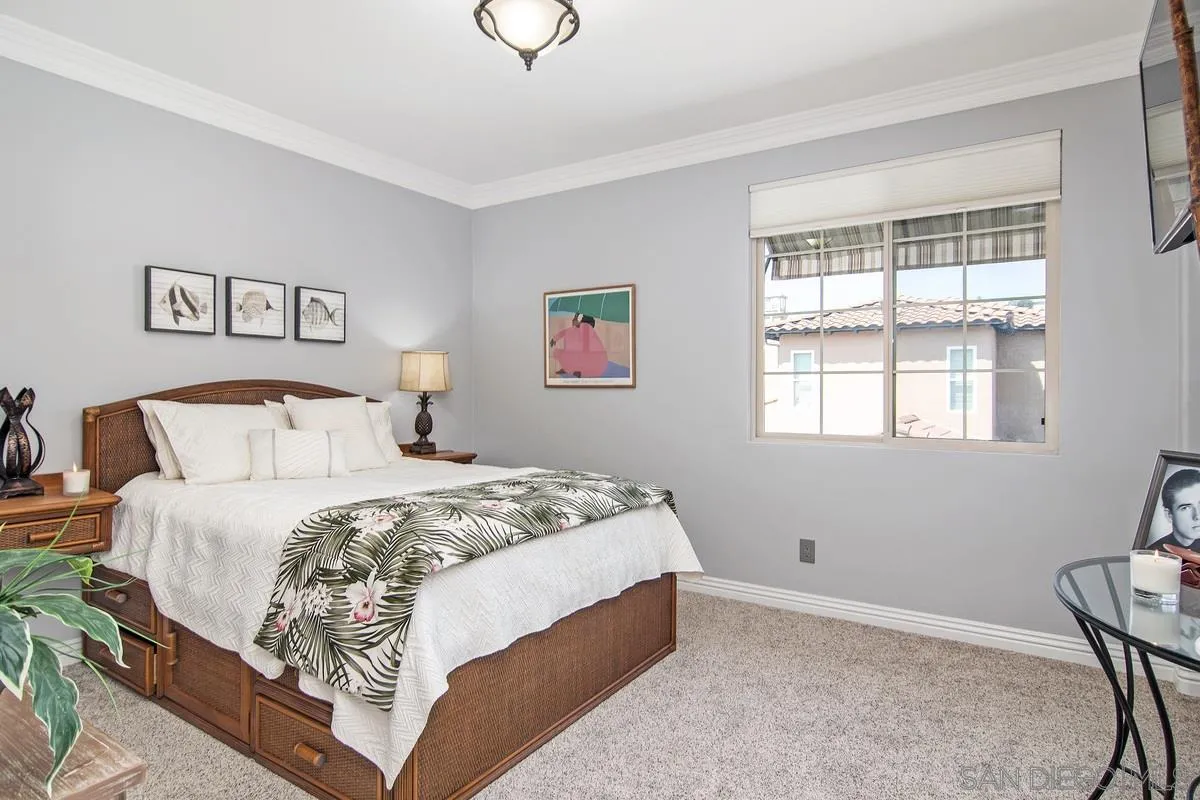 2080 Historic Decatur Road San Diego, CA 92106 - Photo 27 of 47 a bedroom with a bed and a window
