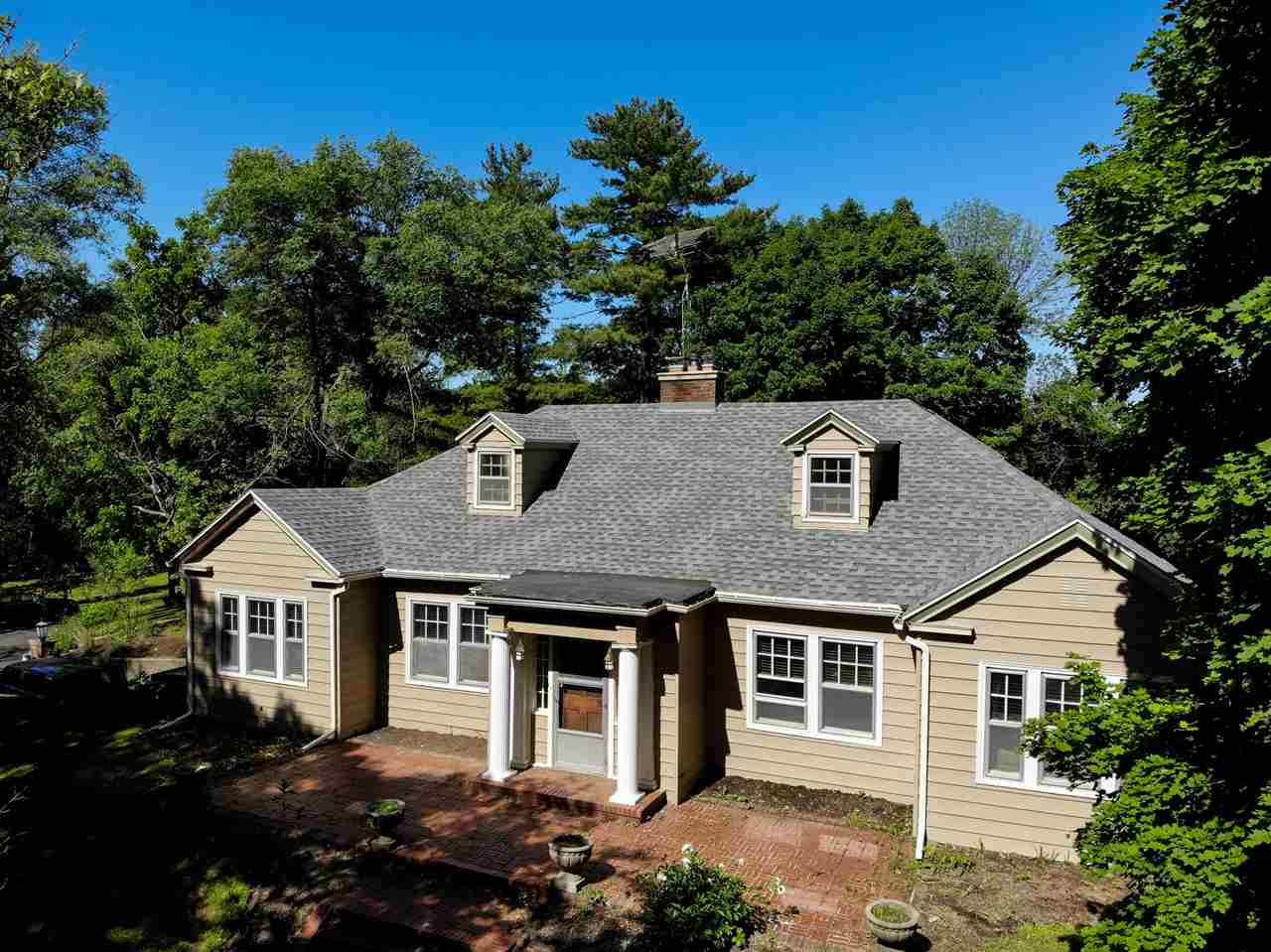 front view of a house with a yard