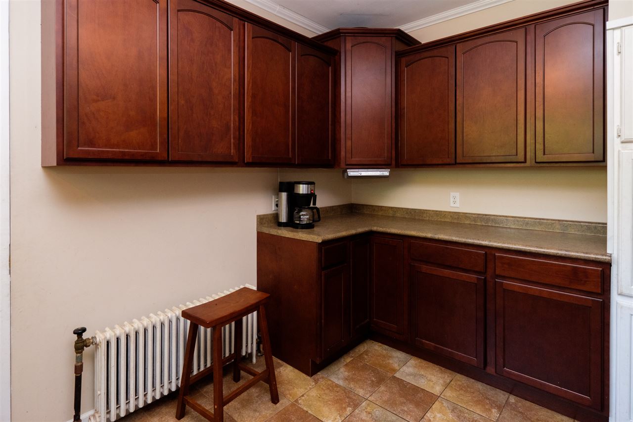 515 South Alpine Road Rockford, IL 61108 - Photo 11 of 25 a kitchen with wooden cabinets and a sink