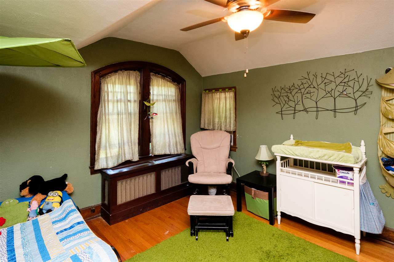 515 South Alpine Road Rockford, IL 61108 - Photo 16 of 25 a living room with furniture and a floor to ceiling window