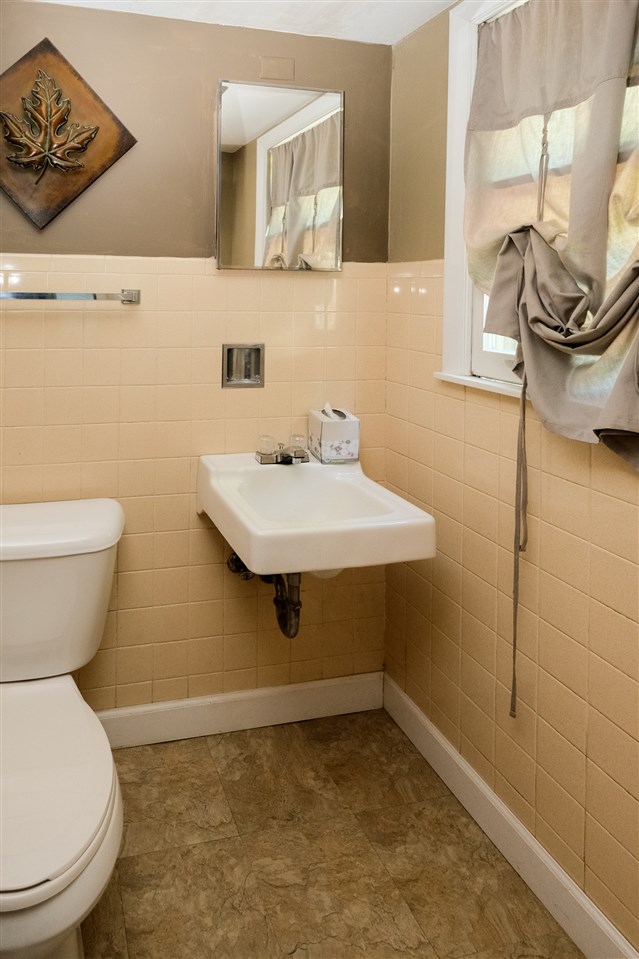 515 South Alpine Road Rockford, IL 61108 - Photo 20 of 25 a bathroom with a sink a toilet and mirror