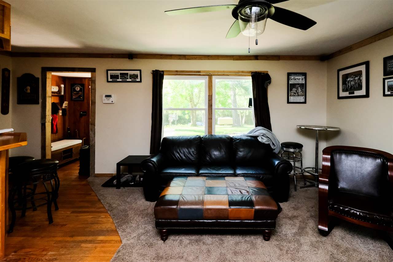 515 South Alpine Road Rockford, IL 61108 - Photo 9 of 25 a living room with furniture and a flat screen tv