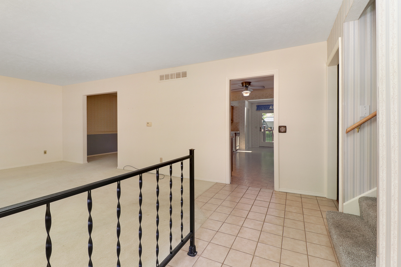 126 South Orr Drive Normal, IL 61761 - Photo 11 of 46 a view of a hallway with wooden floor and staircase