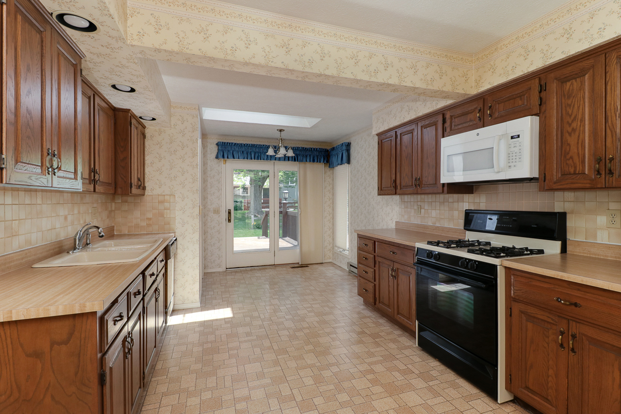 126 South Orr Drive Normal, IL 61761 - Photo 13 of 46 a kitchen with stainless steel appliances granite countertop a sink stove and cabinets