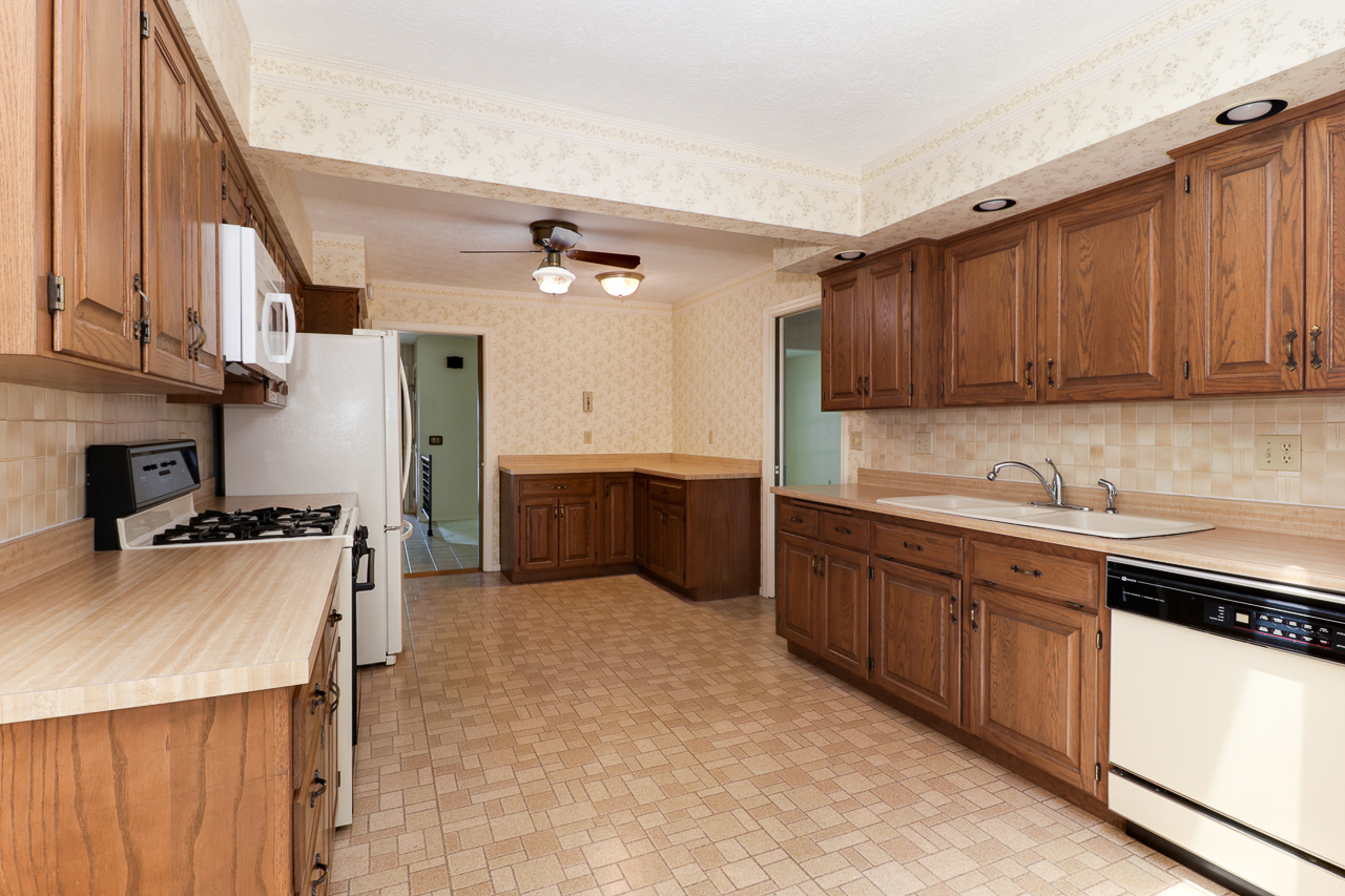 126 South Orr Drive Normal, IL 61761 - Photo 14 of 46 a kitchen with stainless steel appliances granite countertop a sink a stove and a refrigerator