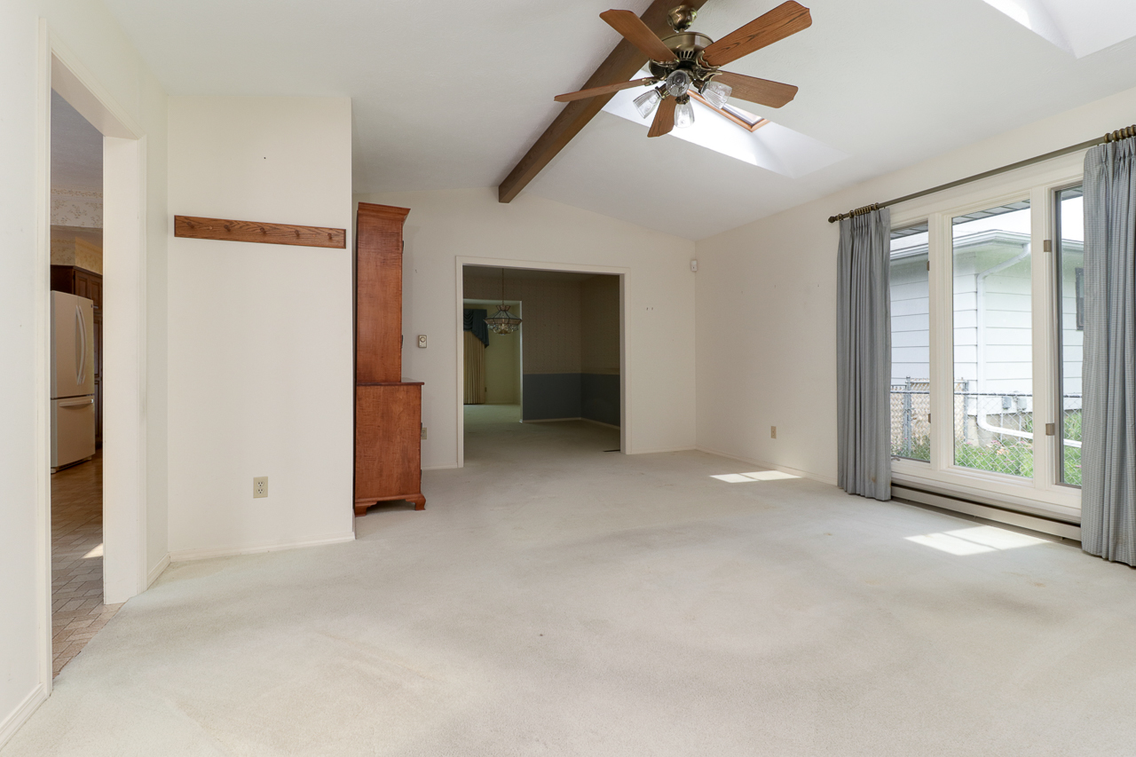 126 South Orr Drive Normal, IL 61761 - Photo 16 of 46 an empty room with chandelier fan and windows