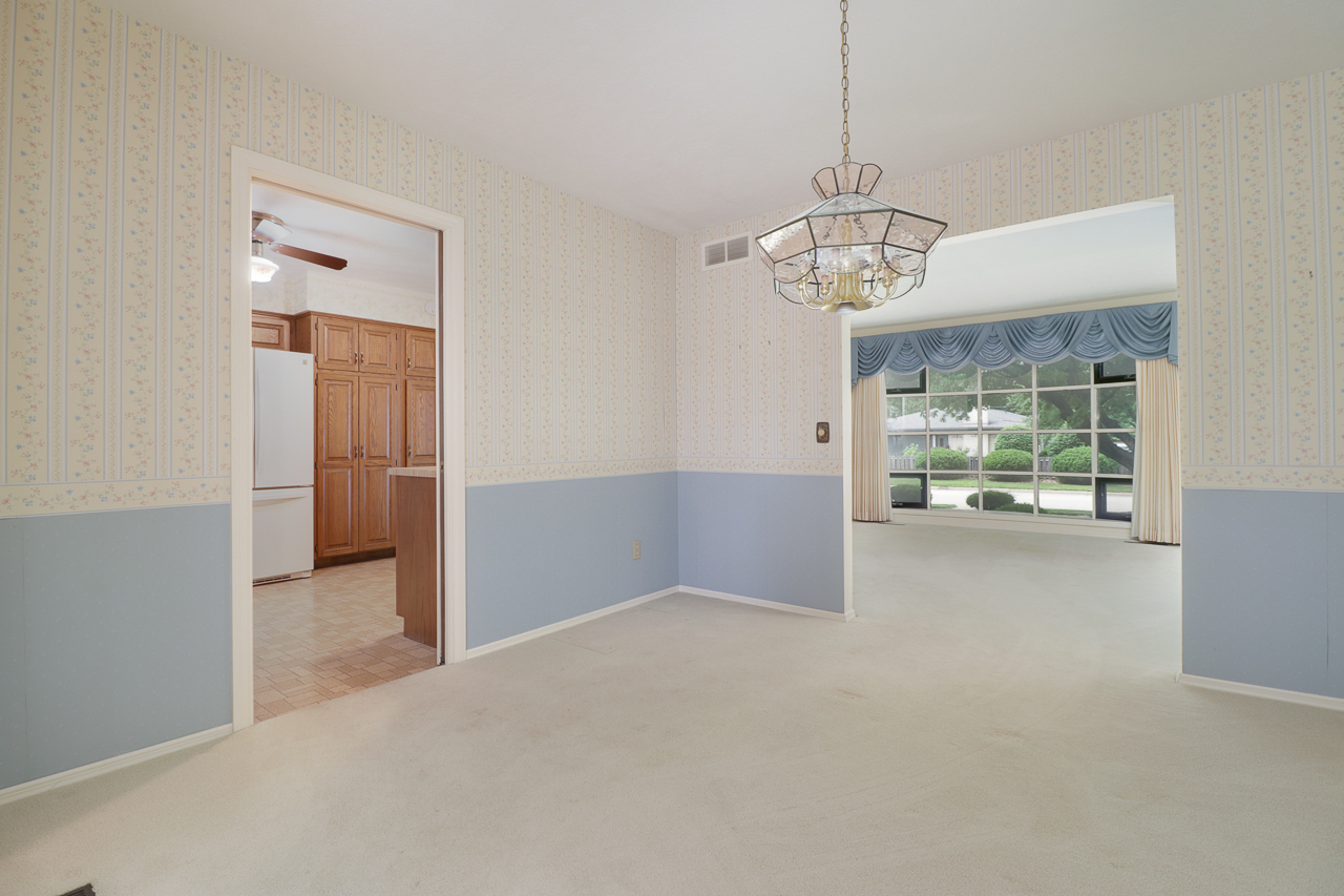 126 South Orr Drive Normal, IL 61761 - Photo 18 of 46 a view of a chandelier in big room and windows