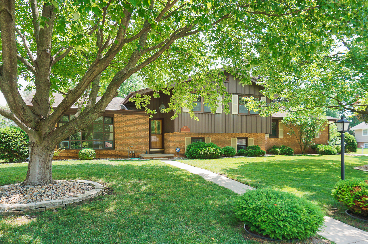 126 South Orr Drive Normal, IL 61761 - Photo 2 of 46 a front view of a house with a garden