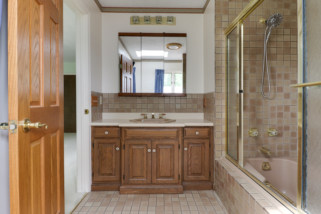 126 South Orr Drive Normal, IL 61761 - Photo 24 of 46 a bathroom with a shower a sink and a mirror