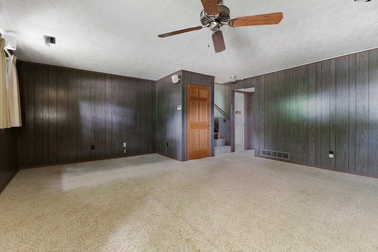 126 South Orr Drive Normal, IL 61761 - Photo 33 of 46 a view of a livingroom with a ceiling fan and window
