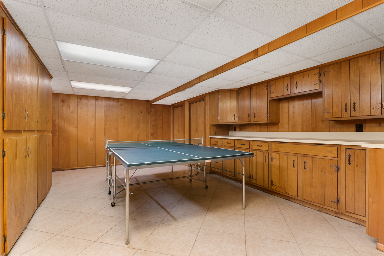 126 South Orr Drive Normal, IL 61761 - Photo 37 of 46 a room with table chairs and wooden cabinets