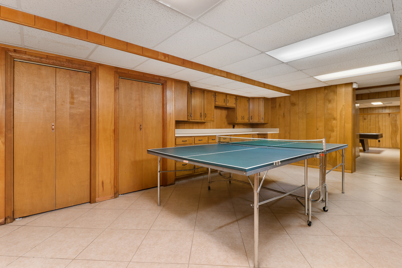 126 South Orr Drive Normal, IL 61761 - Photo 38 of 46 a room with table chairs and wooden walls