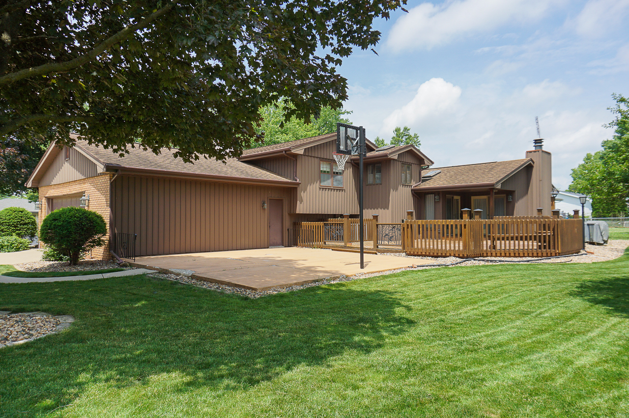 126 South Orr Drive Normal, IL 61761 - Photo 4 of 46 a front view of a house with a yard and garage