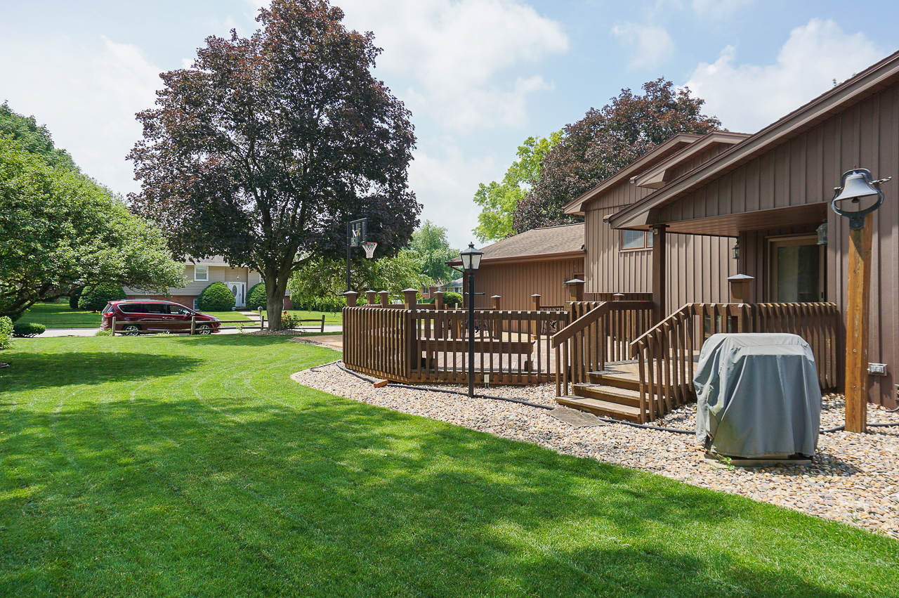 126 South Orr Drive Normal, IL 61761 - Photo 45 of 46 a front view of a house with garden and deck