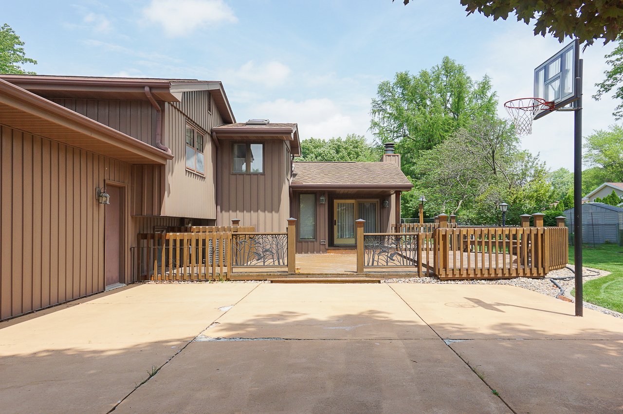 126 South Orr Drive Normal, IL 61761 - Photo 7 of 46 a view of a house with a small yard and wooden fence