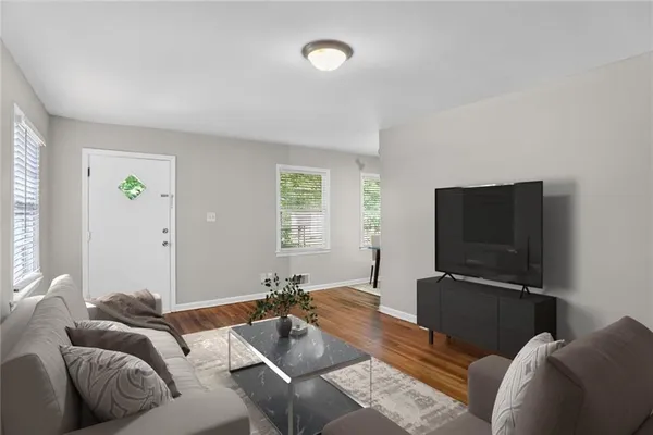 a living room with furniture and a flat screen tv