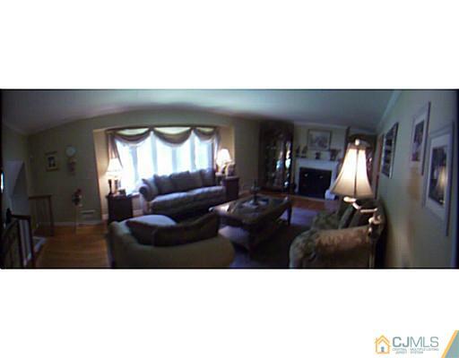 92 George Avenue Edison, NJ 08820 - Photo 5 of 15 a black and white photo of a living room