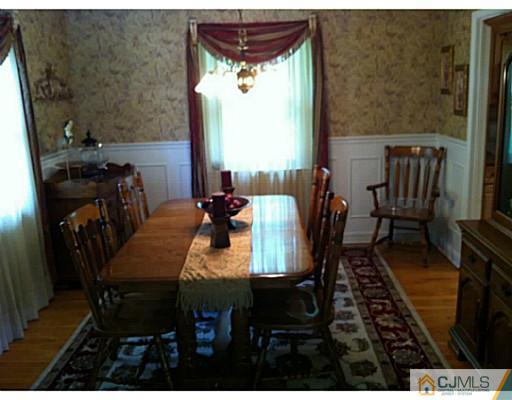 92 George Avenue Edison, NJ 08820 - Photo 6 of 15 a view of a dining room with furniture window and wooden floor