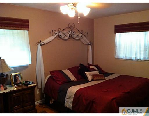 92 George Avenue Edison, NJ 08820 - Photo 7 of 15 a bedroom with a bed and a window