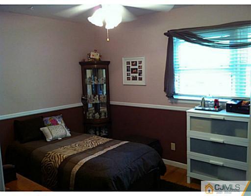 92 George Avenue Edison, NJ 08820 - Photo 10 of 15 a bedroom with a bed and a window