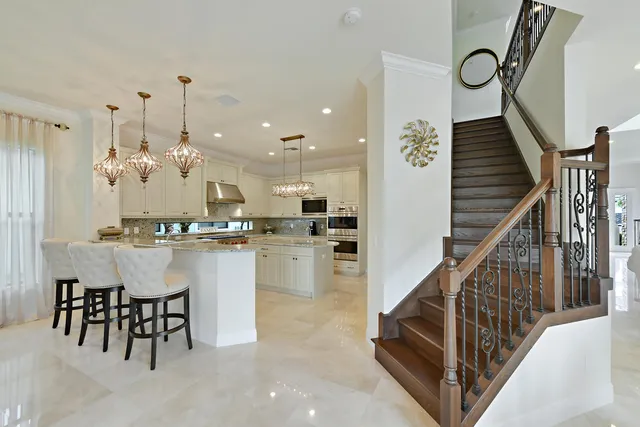 a bathroom with a sink a mirror a toilet and a shower