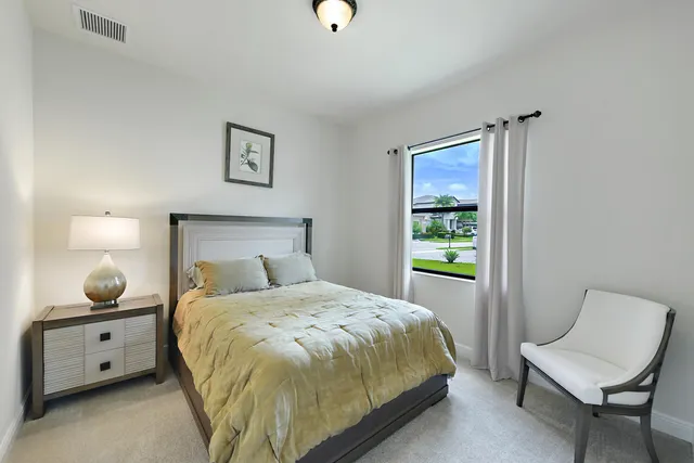 a view of a hallway with seating area