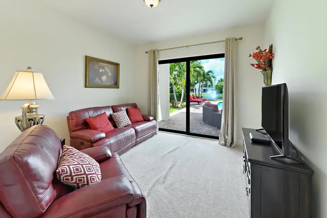 a bedroom with a large bed and a large window