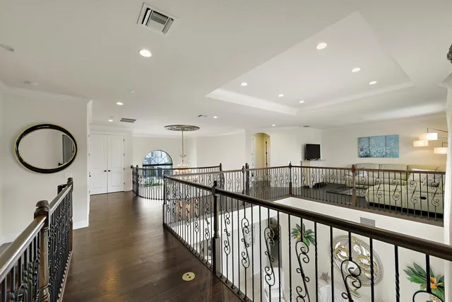a view of a balcony with flower plants