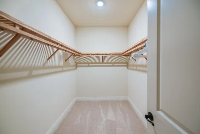 a spacious bathroom with a double vanity sink a mirror a shower and a bathtub