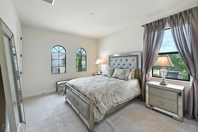 a view of entryway with a chandelier and wooden floor
