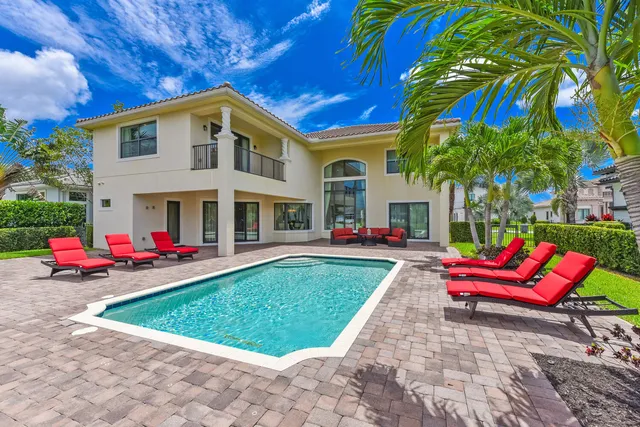 a view of swimming pool with outdoor seating