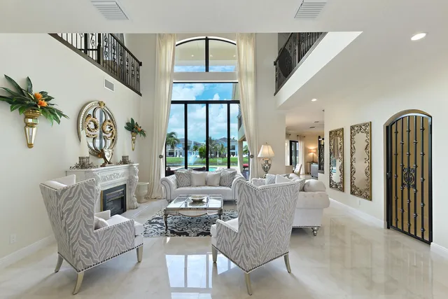 a dining room with furniture and chandelier