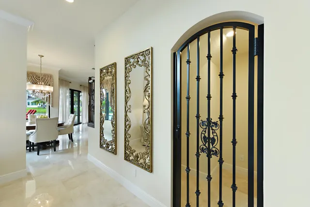 a dining room with furniture a chandelier and a rug