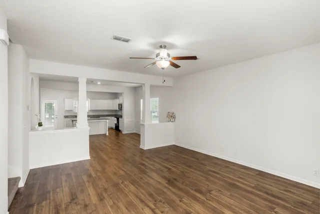 a view of workspace and kitchen with sink