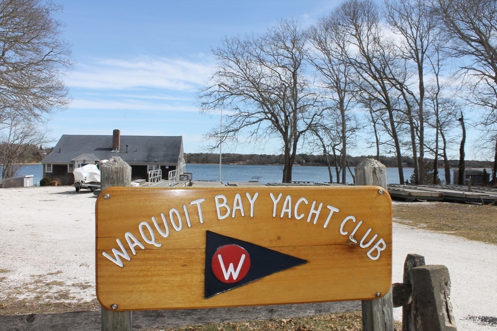 87 Seapit Road, Unit RD Falmouth, MA 02536 - Photo 15 of 21 a view of outdoor space with signage and flags