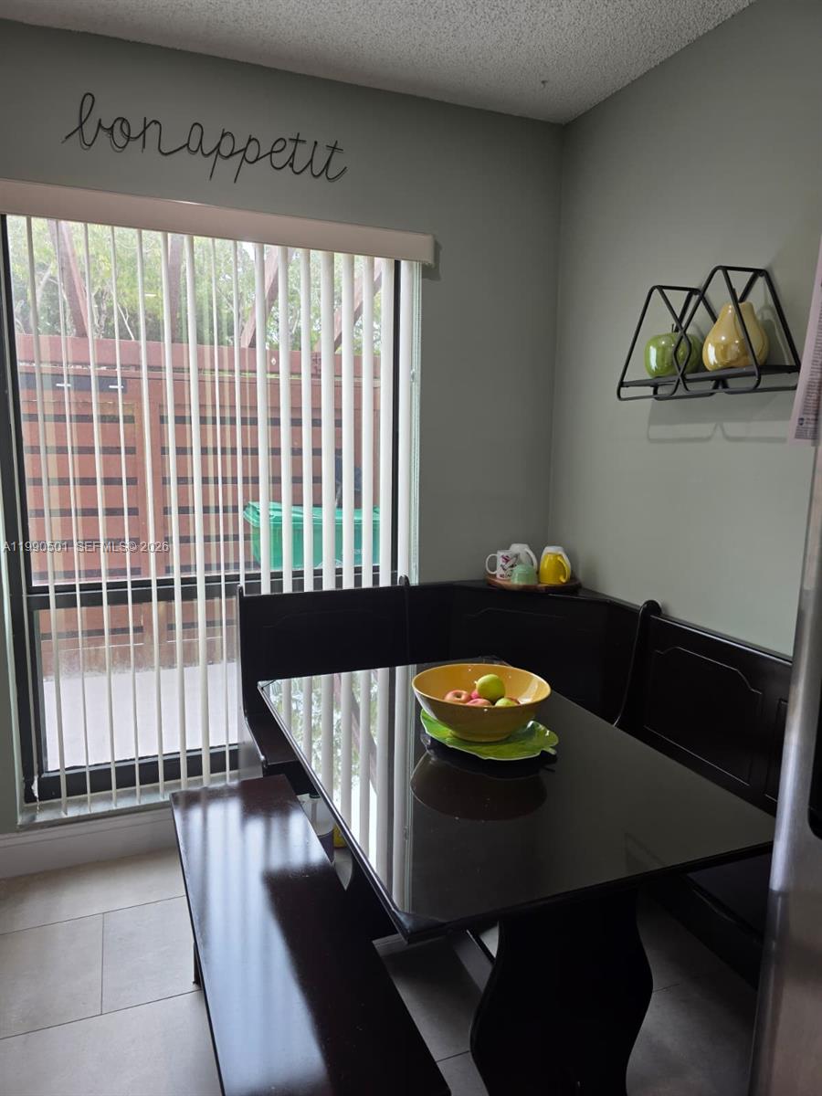 893 Southwest 120th Way Davie, FL 33325 - Photo 6 of 22 a view of a dining room with furniture and window
