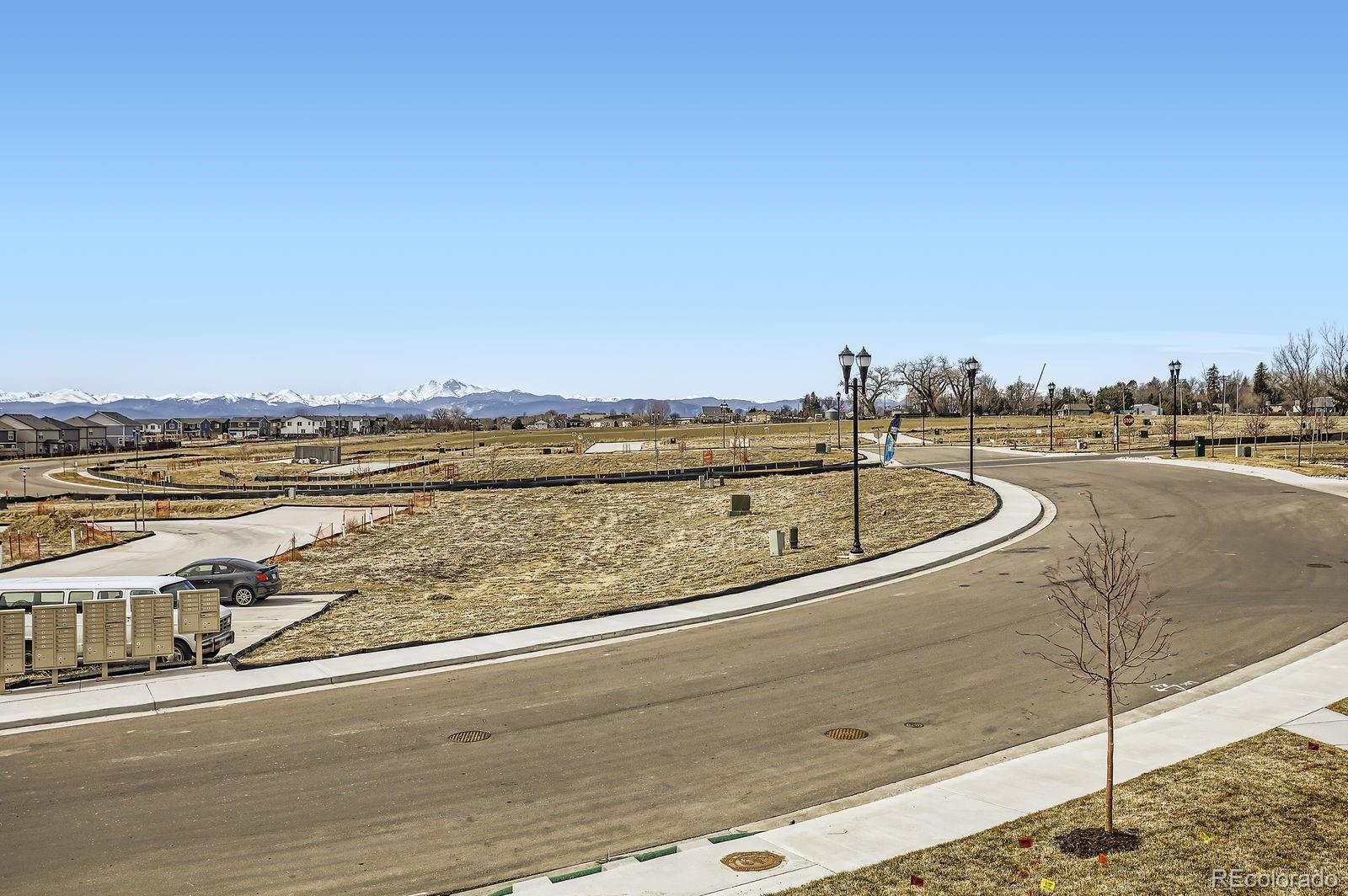 163 Robin Road Johnstown, CO 80534 - Photo 16 of 24 a view of a lake with a outdoor space