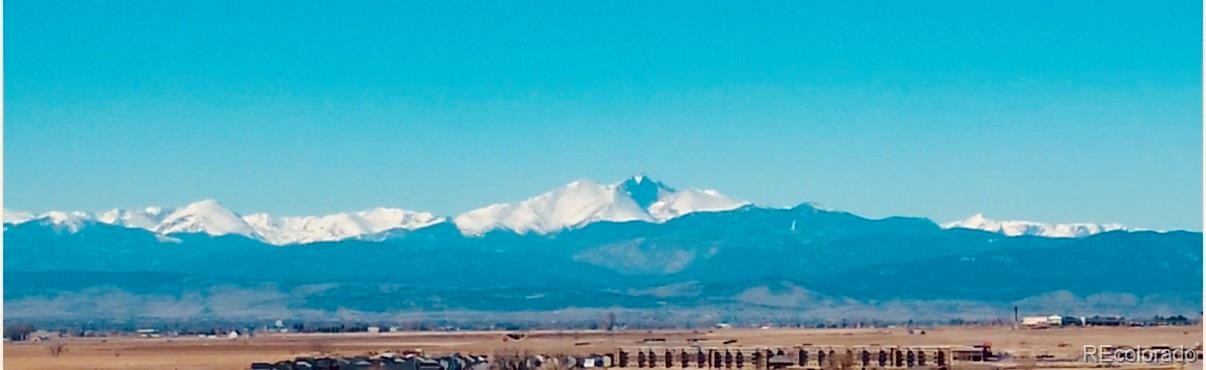 163 Robin Road Johnstown, CO 80534 - Photo 18 of 24 a view of a lake in middle of forest
