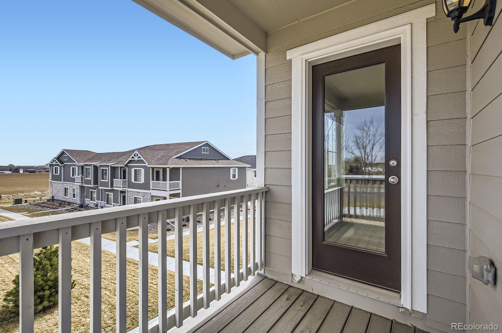 163 Robin Road Johnstown, CO 80534 - Photo 9 of 24 a view of a balcony with wooden floor