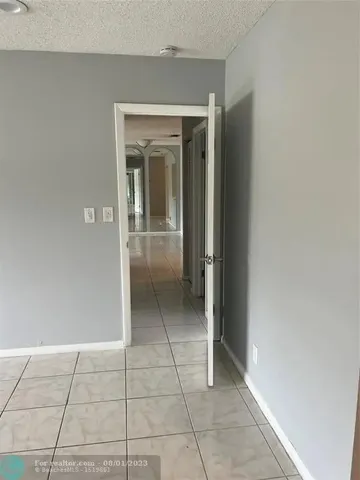 a view of livingroom with an empty space and window