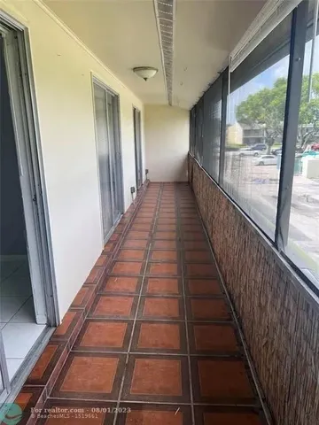 a view of gallery with wooden floor