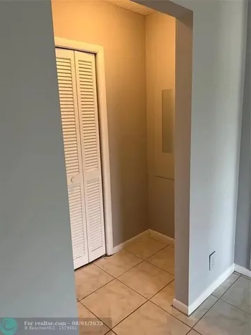 a bathroom with a granite countertop shower a toilet and a sink