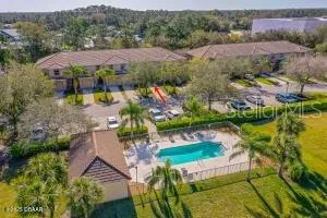 an aerial view of lake residential house and swimming pool
