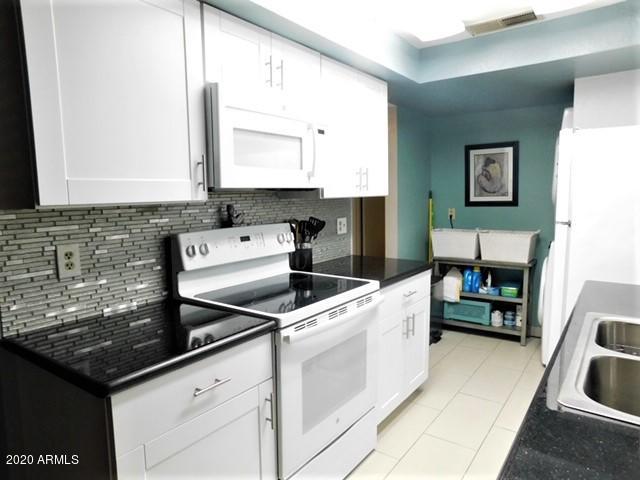 151 East Broadway Road, Unit 207 Tempe, AZ 85282 - Photo 1 of 16 Beautiful glass tiled backsplash