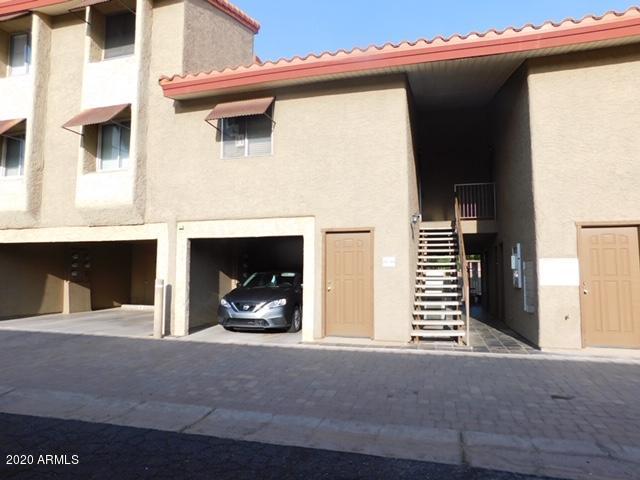 151 East Broadway Road, Unit 207 Tempe, AZ 85282 - Photo 15 of 16 Enclosed carport under the unit
