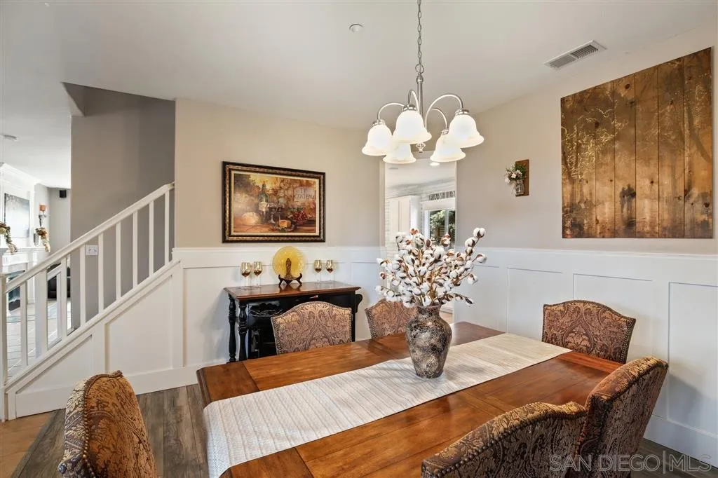 1557 Emerald Ridge Road Fallbrook, CA 92028 - Photo 3 of 25 a view of a dining room with furniture wooden floor and chandelier