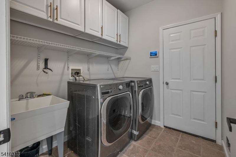 139 Flanders Netcong Road Flanders, NJ 07836 - Photo 24 of 40 a utility room with dryer and washer