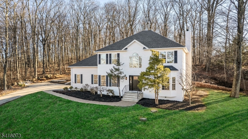 139 Flanders Netcong Road Flanders, NJ 07836 - Photo 3 of 40 a front view of a house with a garden and trees