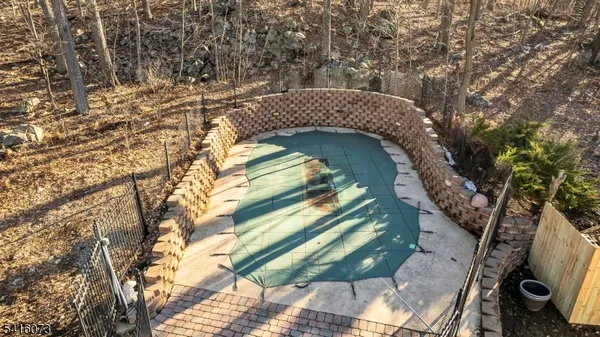 a view of a wooden house with a tree